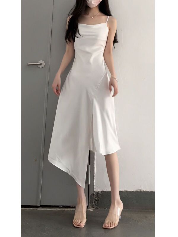 Summer White Satin Slip Dress for Women with a High-End Feel, Featuring a Slit and Irregular Mid-Length Design Summer White Satin Slip Dress for Women with a High-End Feel, Featuring a Slit and Irregular Mid-Length Design