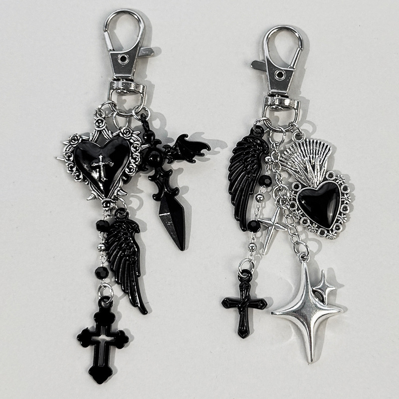 Gothic-style black cross and star keychain with heart wings, bag pendant, unique and versatile accessory Gothic-style black cross and star keychain with heart wings, bag pendant, unique and versatile accessory