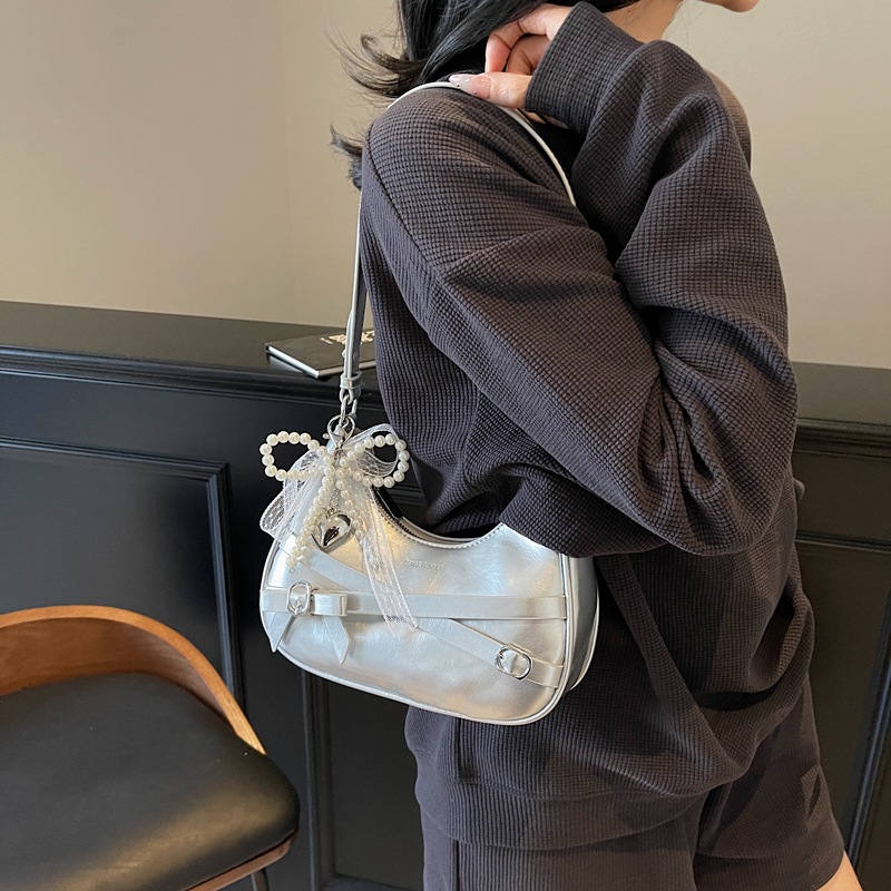 Nicho de cera de aceite bolso de piel mujer 2025 nuevo estilo de verano de moda de encaje arco brazalete textural mochila