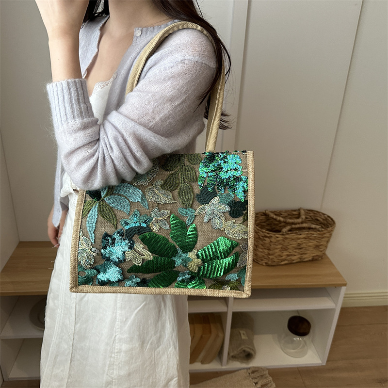 Explosiones transfronterizas 2026 textura de lino de alta calidad, flores bordadas, bolsas de tendencia horizontales, bolsas de compras de aire exterior