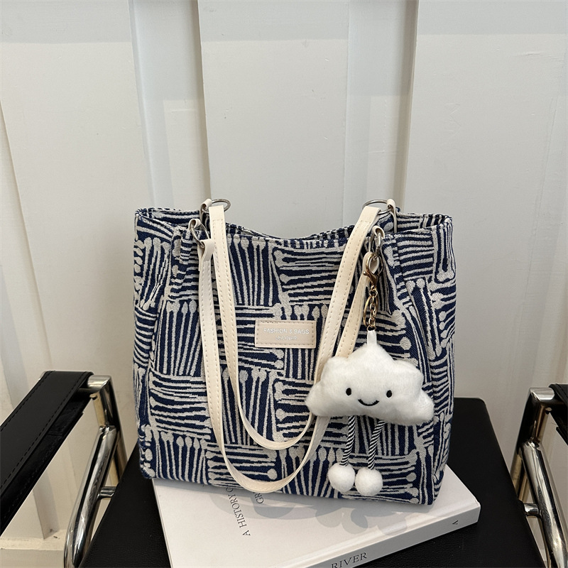 Bolso a rayas casual de todos los partidos de nicho para mujer 2024 nuevo bolso de hombro de gran capacidad de moda retro bolso de viaje