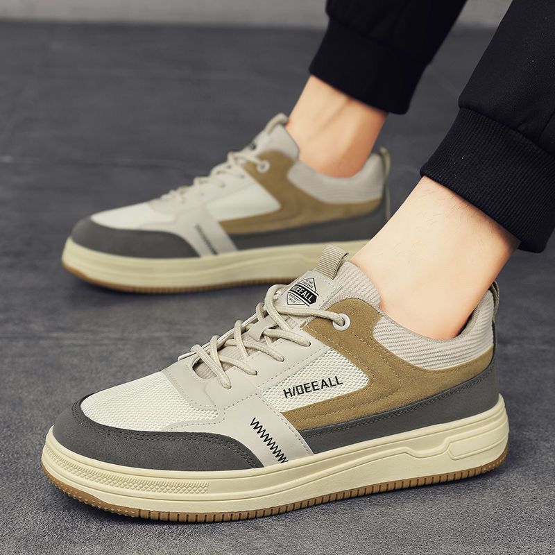 Zapatos de hombre invierno 2026 nuevo estilo ventilado puerto viento versátil anti-sucio zapatos de malla de moda ligero con suela suave zapatos deportivos casuales