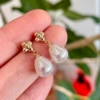 Golden earrings flower-shaped from pearl