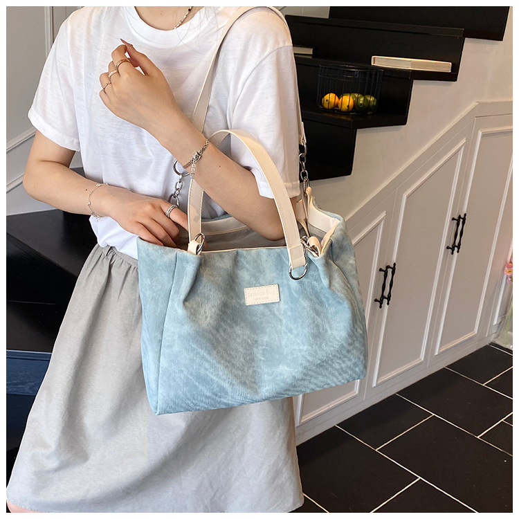Korean style simple and versatile bag for women, new summer 2025 fashion and niche handbag, large capacity tote bag for commuting undefined