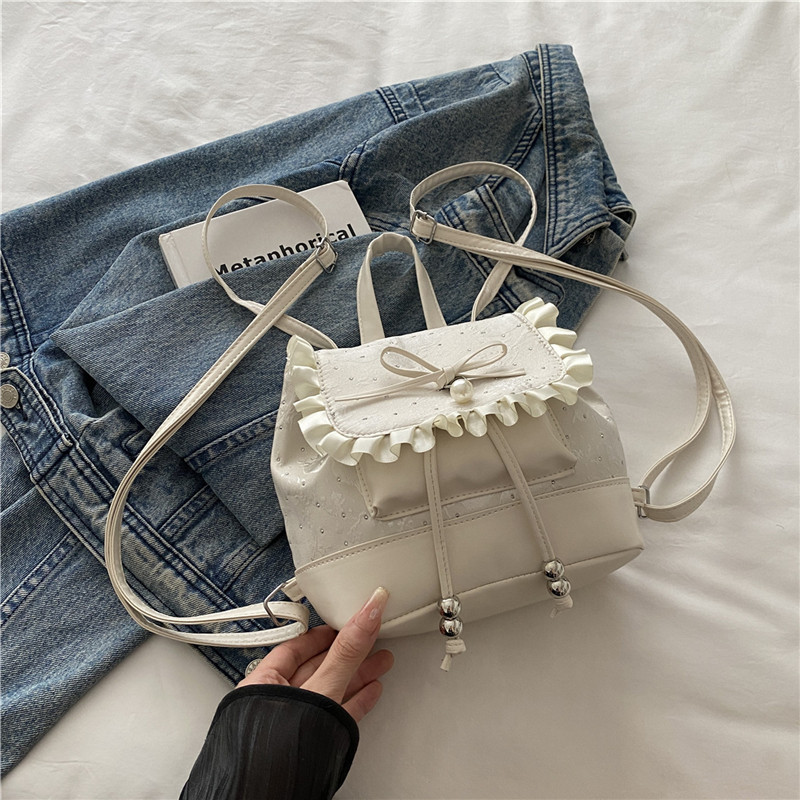 Bolsa de mano de moda coreana de chicas 2025 nuevo encaje de alto valor de la cara, mochila de hombro versátil