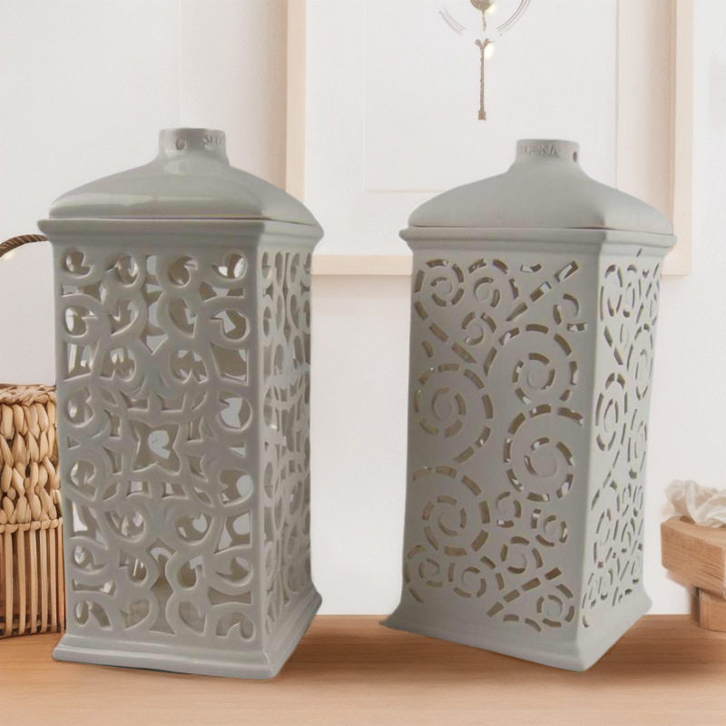 Moderno y simple cerámica nórdica LED linterna hueca vela candelabro decoración interior ligero de lujo lámpara de viento