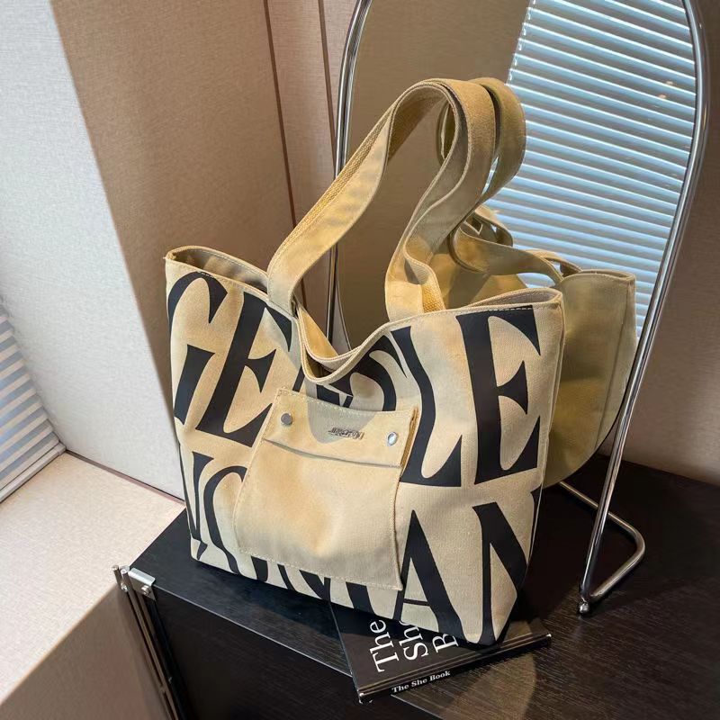 2024 new one-shoulder canvas bag large capacity letters Western style student class artistic handbag fashion shopping bag 2024 new one-shoulder canvas bag large capacity letters Western style student class artistic handbag fashion shopping bag