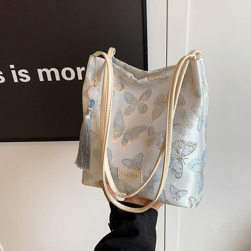 Personalización de fábrica nuevos bolsos de estilo chino para mujer verano nueva moda estilo nacional bordado bolso de cubo casual bolso de hombro de todo fósforo