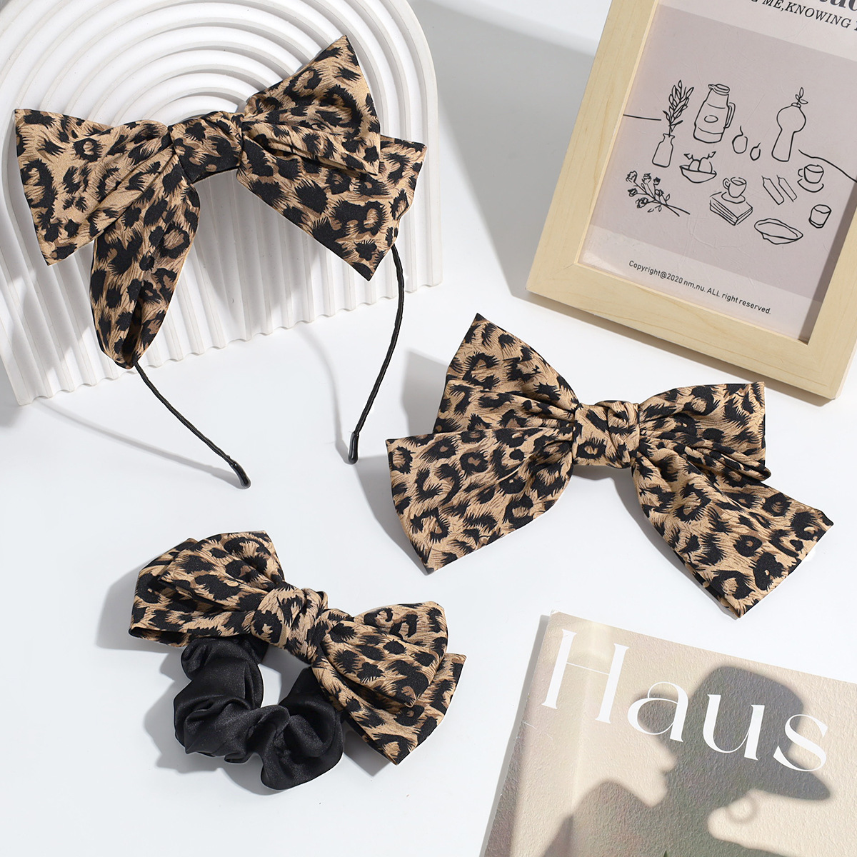 Estilo de moda europeo y americano personalidad nicho de diseño arco leopardo aro de pelo clip de resorte retrógrado anillo para el pelo accesorios para el pelo