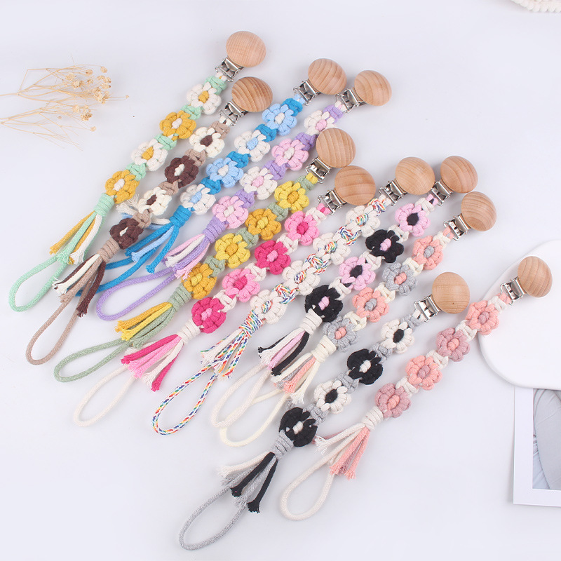 Productos para bebés Clip de chupete de haya de dibujos animados DIY creativo cuatro flores cadena de chupete de cuerda de algodón tejido a mano
