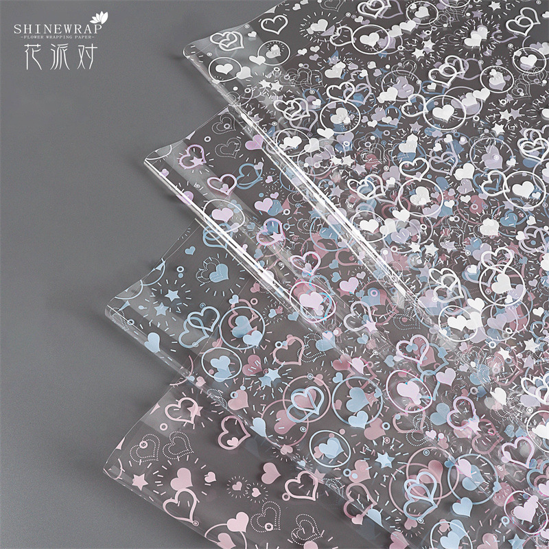 Fábrica de fiestas de flores al por mayor nuevo festival Qixi amor flor de papel de envoltura de flores transparente flores de papel de envoltura de flores regalos floristas