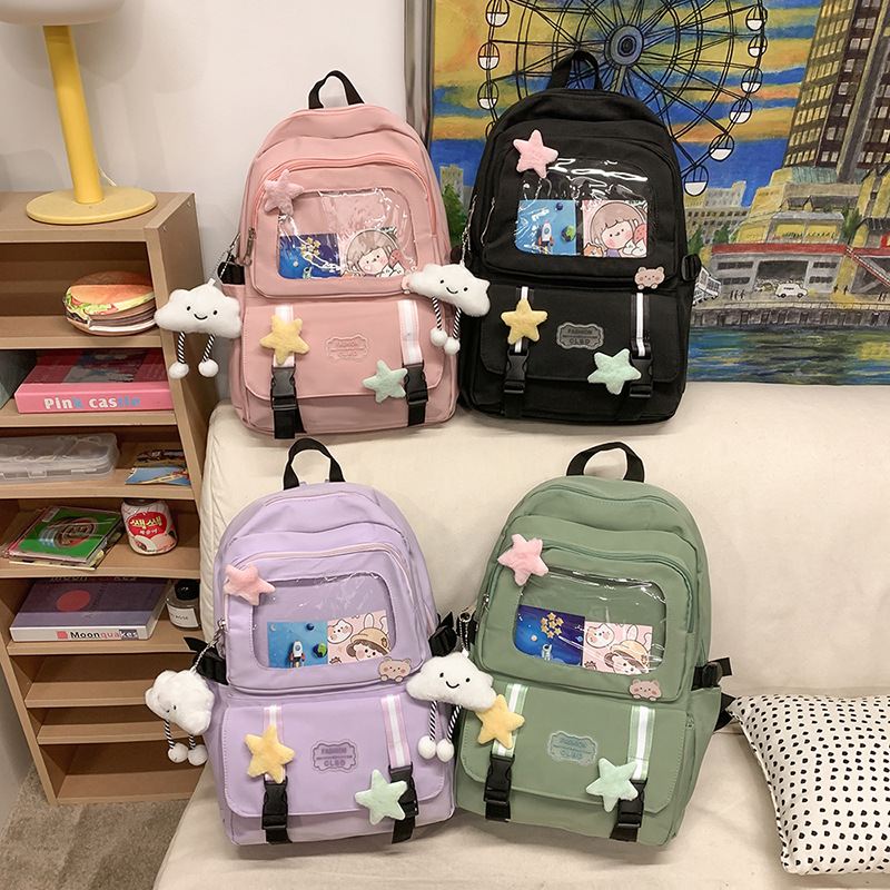 Mochilas escolares de moda bolsos de hombro para niñas estudiantes de primaria y secundaria sencillos paños transfronterizos ligeros bolsos de mano al por mayor bolsos de gran capacidad