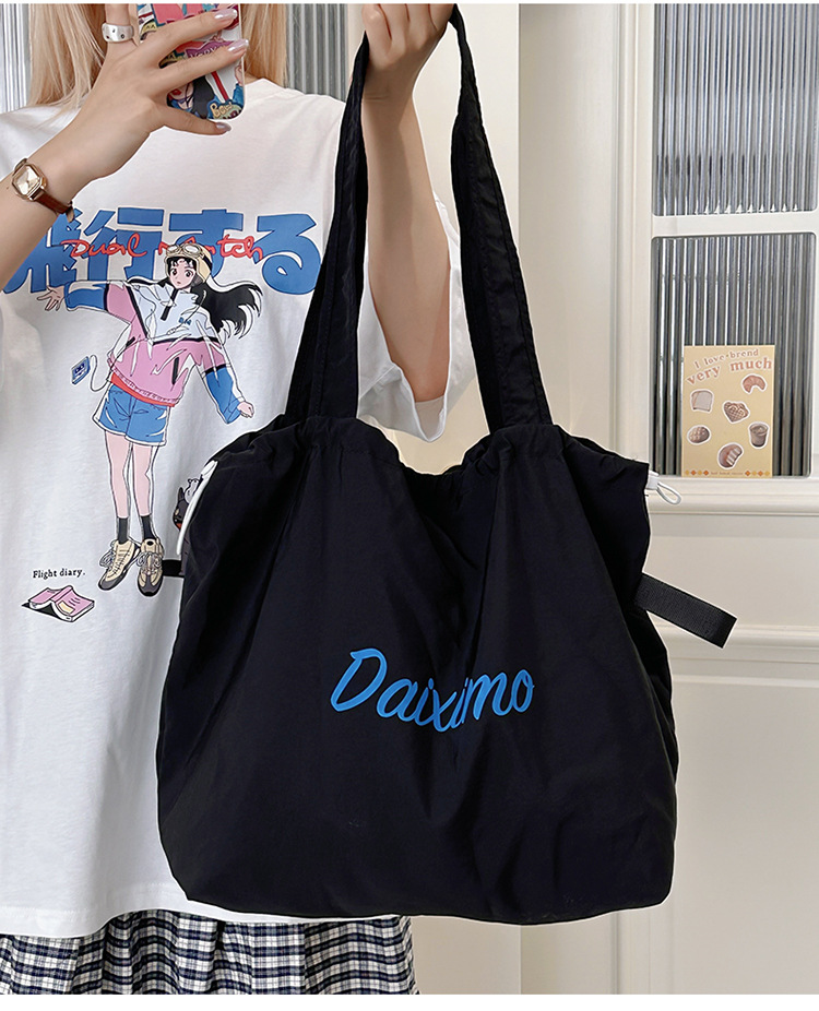 Solid color large-capacity tote bag 2025 bestseller, fashionable commuting lightweight handbag, laid-back style drawstring nylon bag for women undefined