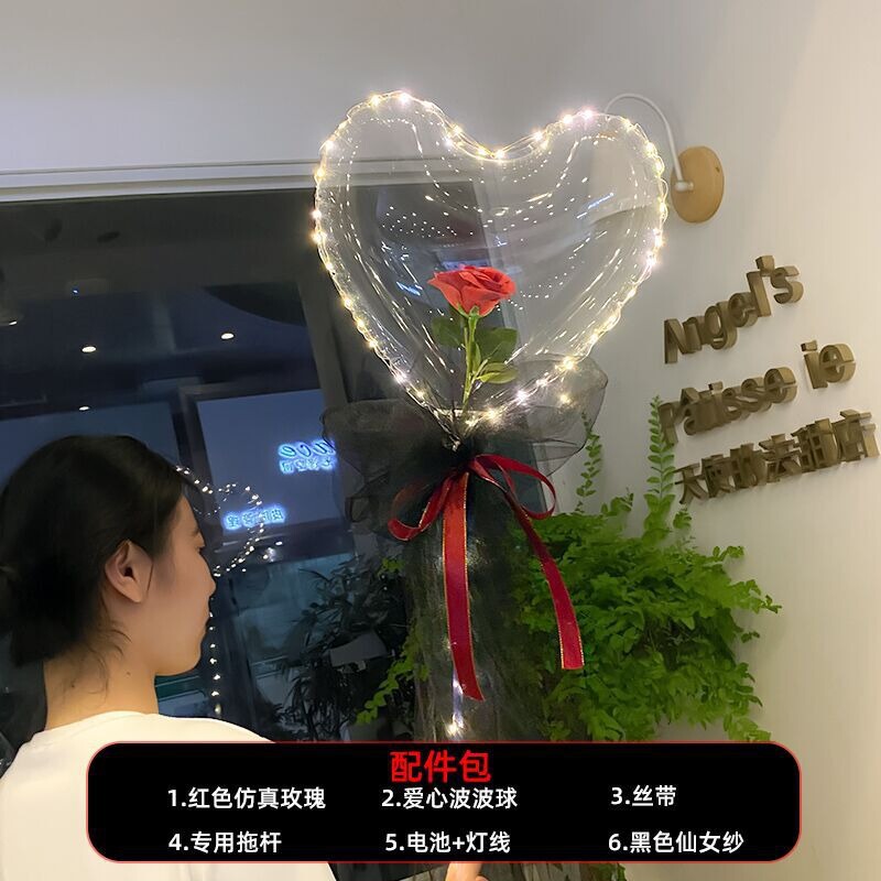 光る夜市の円形の赤い屋台のネットを並べてボールを押して会の風船のイルミネーションの明かりの告白のロマンチックな波の地帯のスーツを押します。|undefined