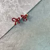 Red mosquito coil with bow, ear clips