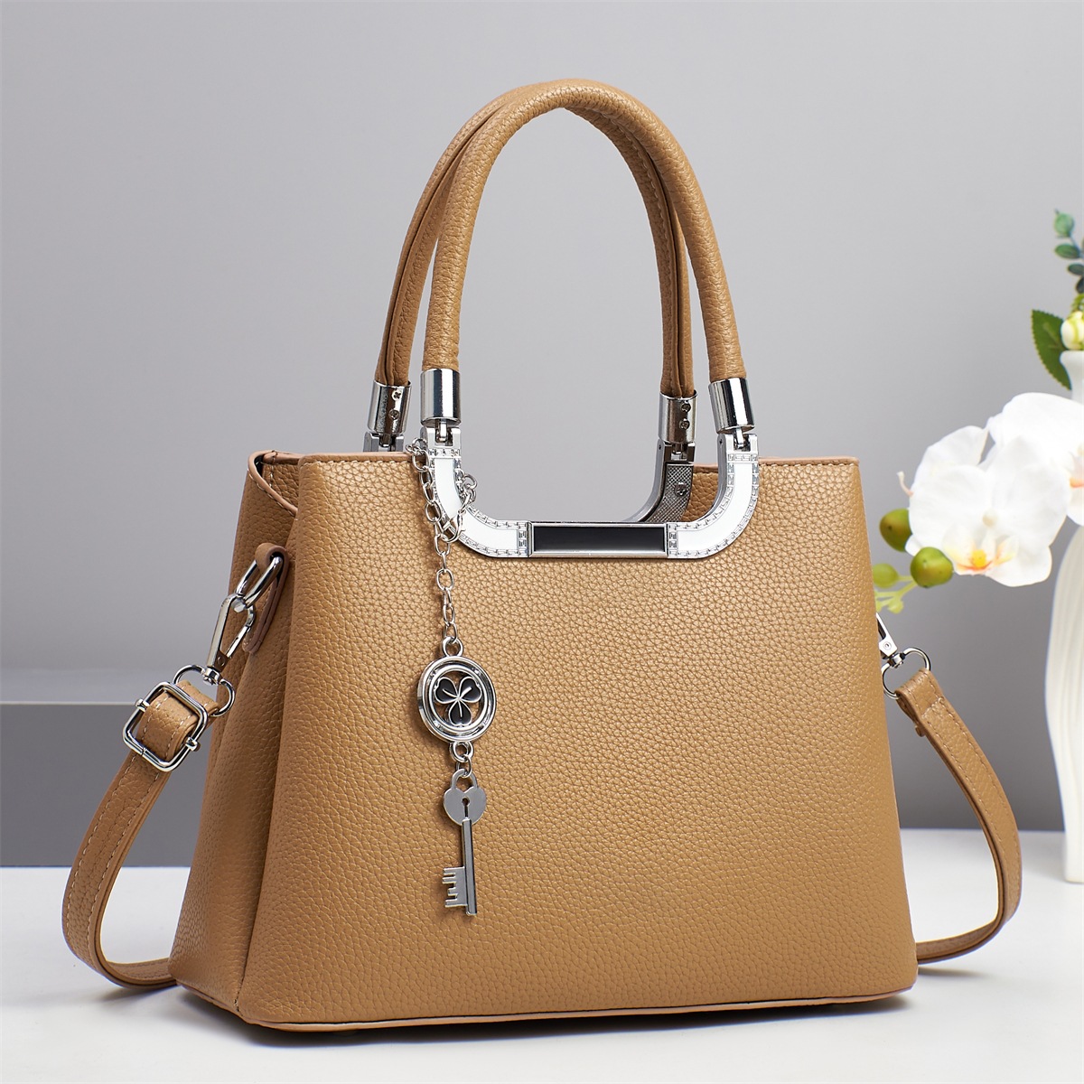 Bolso bandolera de todo fósforo nuevo patrón de lichi de gran capacidad sensación de alta calidad 2025 marca bolso atmosférico mujer de mediana edad