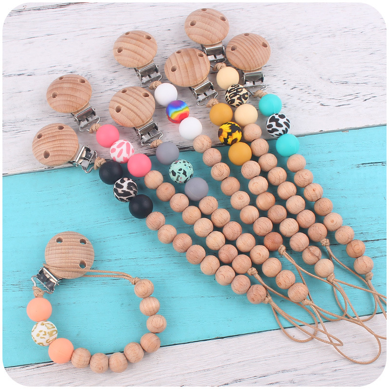 Nuevos suministros para bebés Beech chupete clip calmante bebé macaron cuentas impresas mordedura chupete cadena anti-caída de la cadena