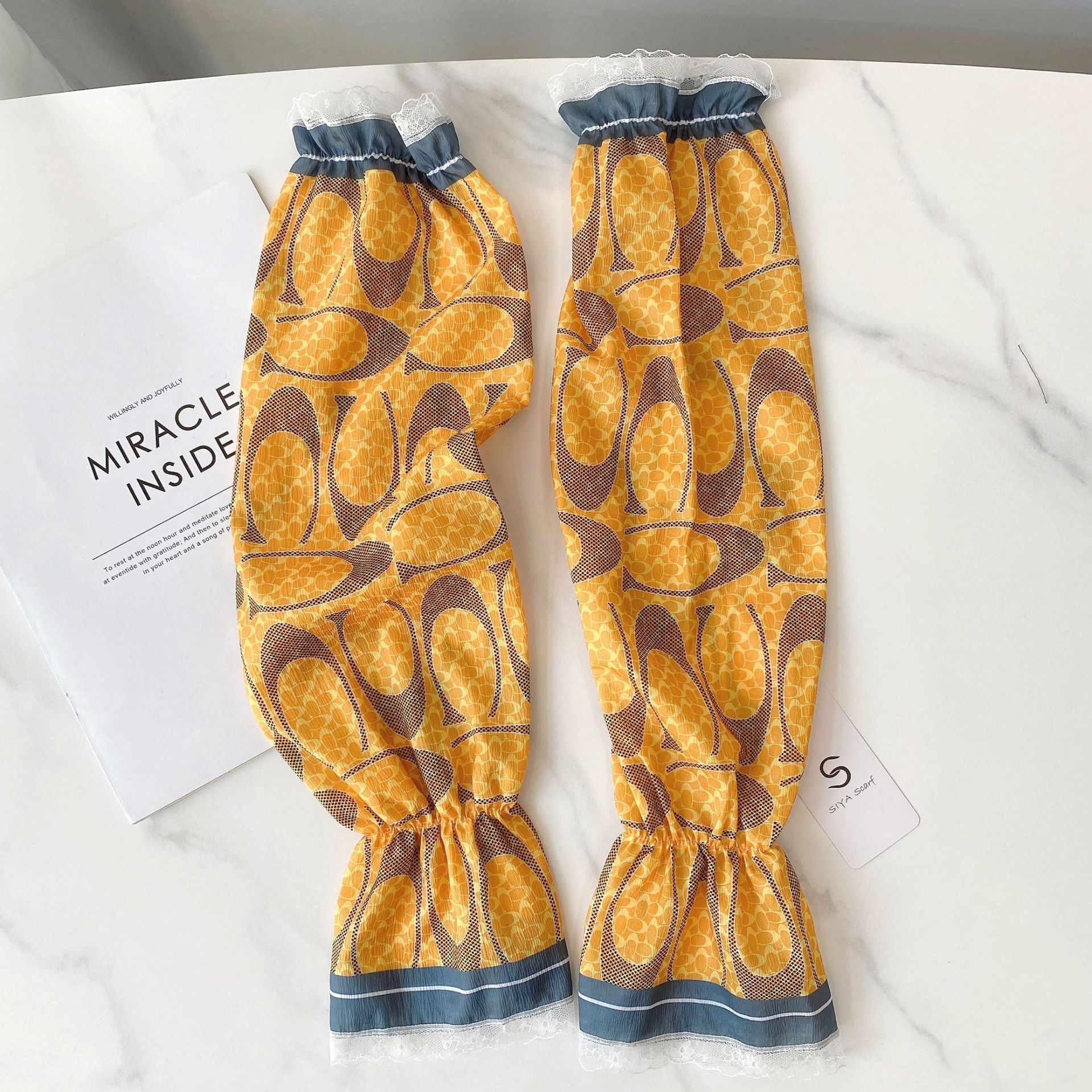 Verano estilo coreano ligero transpirable overse manga de encaje de las mujeres protección solar fresca manga de hielo satinado protección del brazo de conducción al aire libre al por mayor