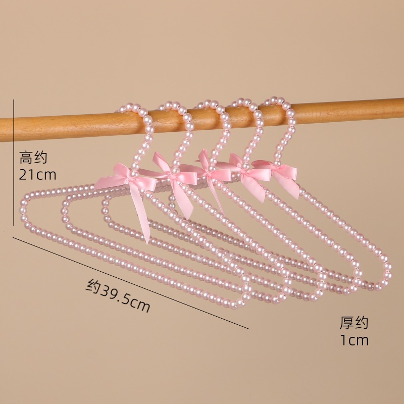 Tienda de ropa de mujer perla lujo ligero vestido retro arco adulto percha de ropa infantil estilo europeo hadas soporte de abrigo