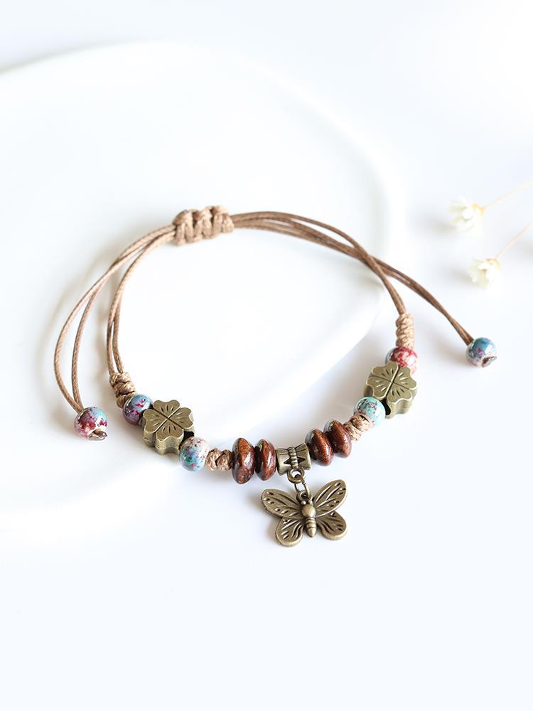 Ethnic woven bracelet with beads with butterfly