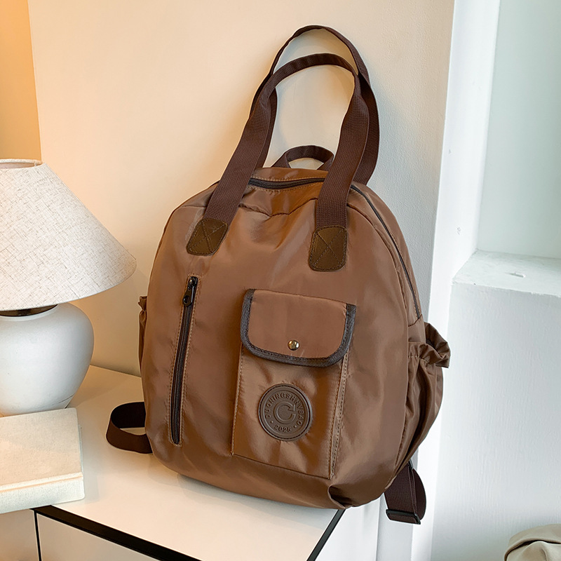 Otoño nuevo estilo de alta sensación compacto simple versátil gran capacidad viaje mochila de hombro bolsa multipropósito hombro
