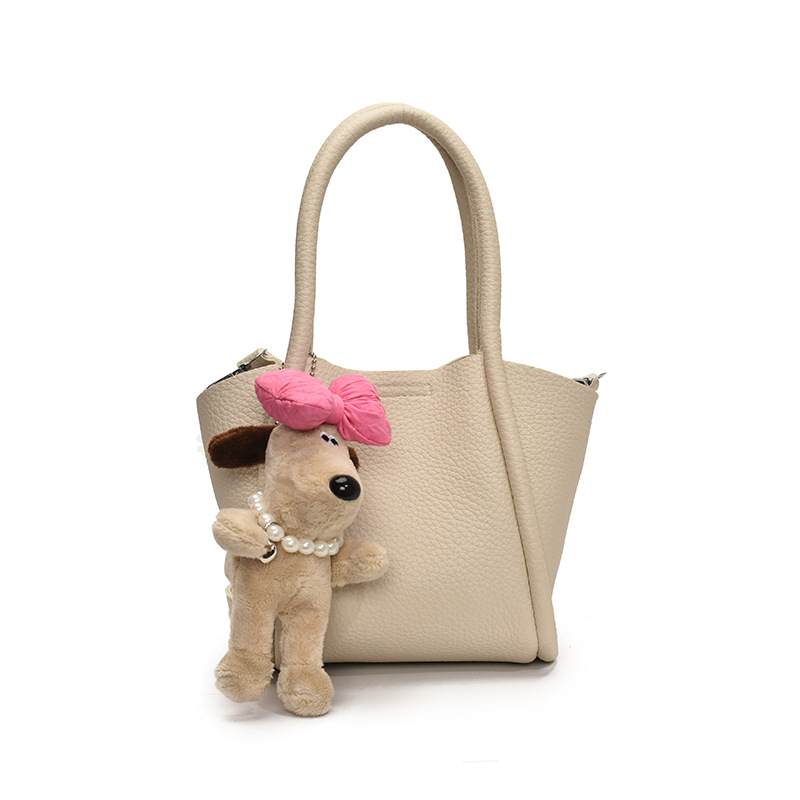 Bolso de cubo de mano de estilo explosivo transfronterizo para mujer 2025 nuevo bolso de hombro de alta gama de nicho bolso de cesta de verduras de moda coreana