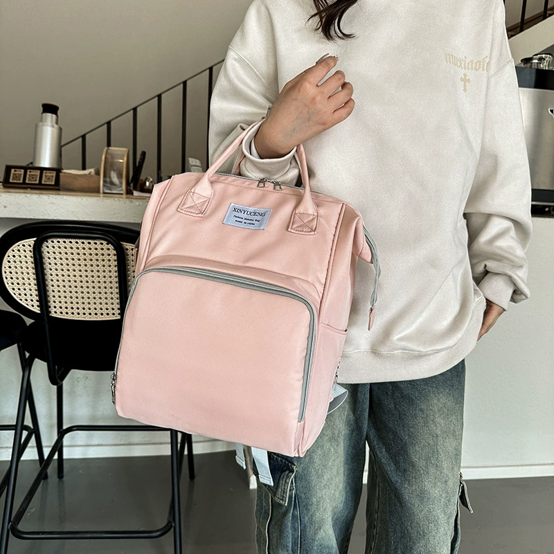Capacious shoulder bag for mother and baby, storage system, universal backpack