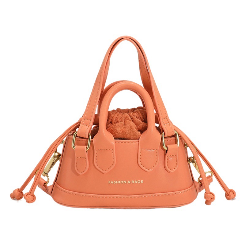 2022 Otoño e Invierno Nueva textura de los niños bolso de mano de moda europea y americana mini bolso de la cáscara transfronteriza bolsa de las mujeres