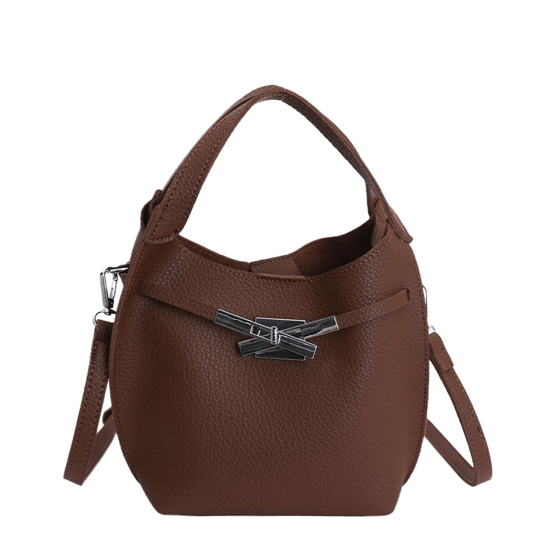 Bolso de mujer nuevo estilo coreano nicho de moda lichi bolso de cubo portátil de alta sensación de ocio mochila de viaje
