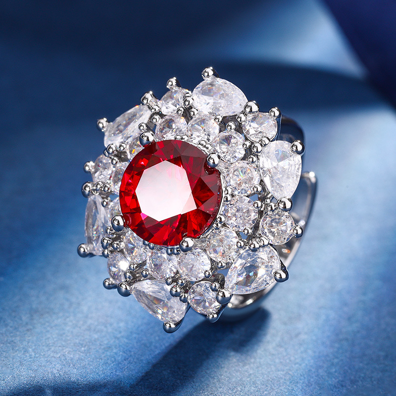 El otoño y el invierno Nueva Zhuang Sheng joyería de cobre inferior chapado en oro de simulación de corindón rojo temperamento redondo luz traje de lujo femenino 10mm7m