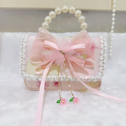 Otoño nuevo bolso infantil princesa perla bolso de mano pequeña fragancia chica bolso de moda bebé portátil