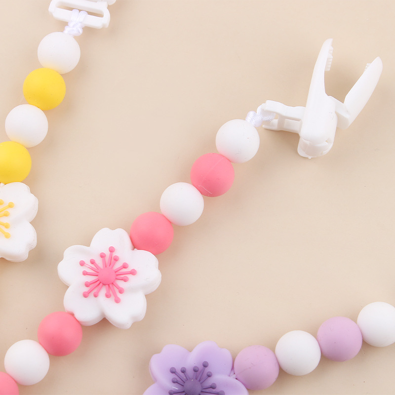 Productos para bebés Clip de chupete de plástico de bricolaje para bebés Flor de begonia creativa gel dental de silicona Chupete anti-caída de la cadena