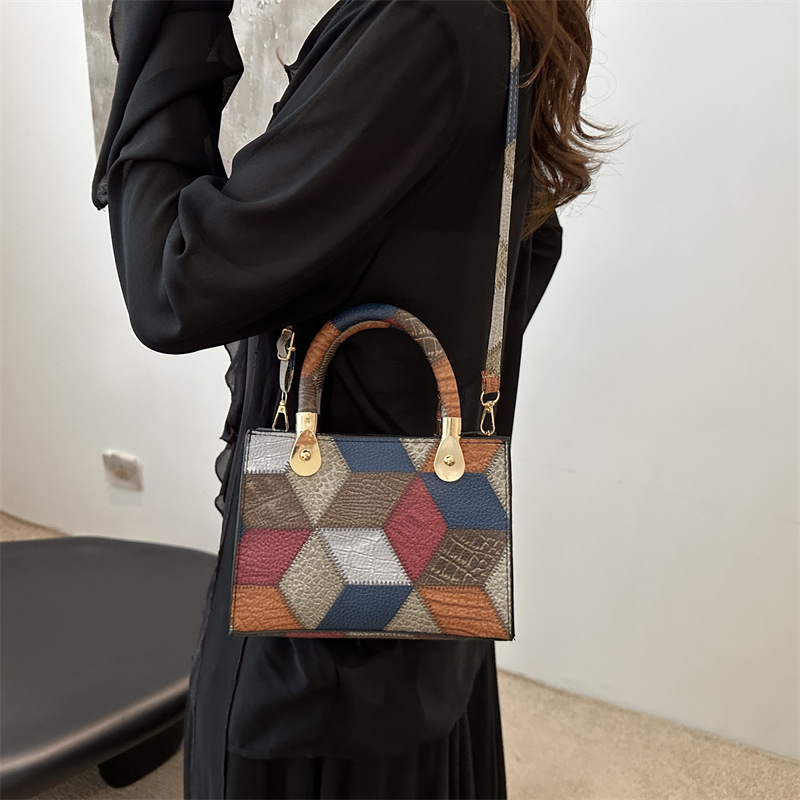 Nueva bolsa de hombro de mujer simple empalme de moda de gran capacidad bolsa de mano PU cuero suave sensación casual portátil ligero