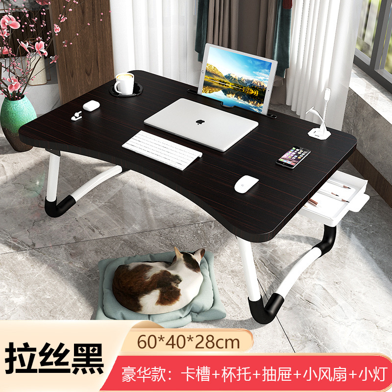 ノートパソコンの机の上で折り畳みます。|undefined