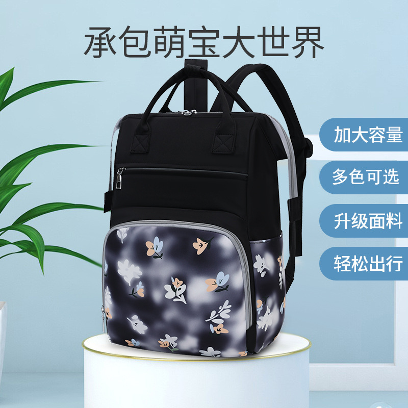 Bolsa de mamá nueva moda impresa mochila de viaje portátil mochila de mano bolsa de biberón independiente bolsa de bebé