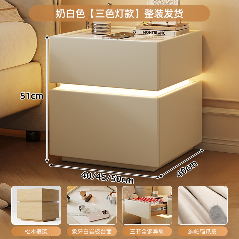 Mesa de cabecera de madera maciza dormitorio doméstico 2025 explosión ligera de lujo de alto nivel sensación de viento crema pequeño gabinete de almacenamiento de la cama inteligente