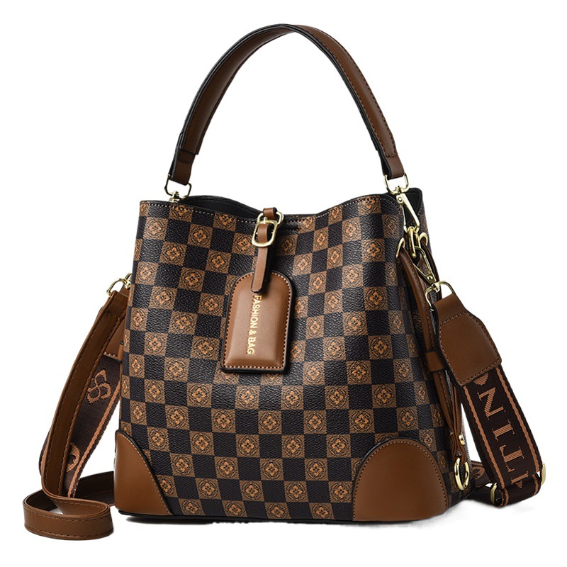 Bolsos bolsos de mujer bolsos de moda retro 2025 bolsos de nuevo estilo de gran capacidad y sentido de alta calidad bolso de cubo diagonal de un solo hombro mujeres