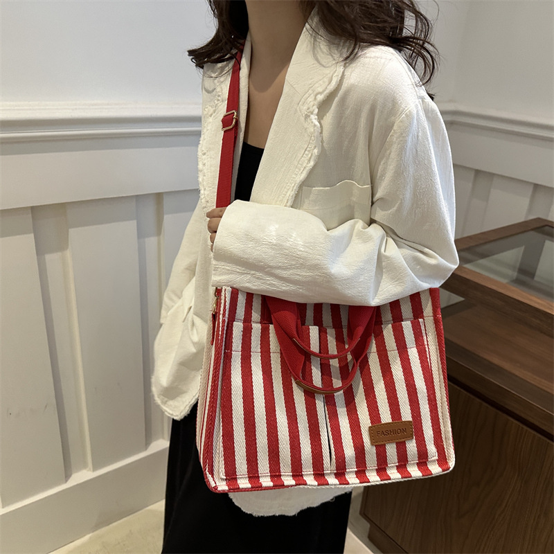 Bolsas de gran capacidad de transporte 2024 nuevas bolsas de mujer populares bolsas de lona a rayas bolsas de mochilas de moda bolsas de mano