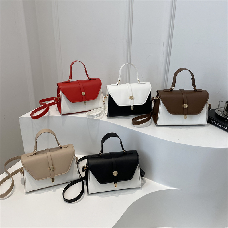 Bolsa de mano de textura de empalme retro para mujeres 2025 nuevo estilo simple y casual de moda extranjera bolso de hombro