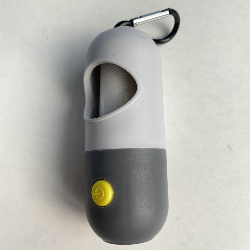 LED píldora mascota bolsa de basura distribuidor con luz perro inodoro Dispositivo de almacenamiento portátil mascota inodoro