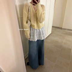 刺繍レースのおならのカーテンのレースの半身のスカートの白い秋冬の短いタイプの裾の新型は底のお尻のショートスカートを打ちます。
