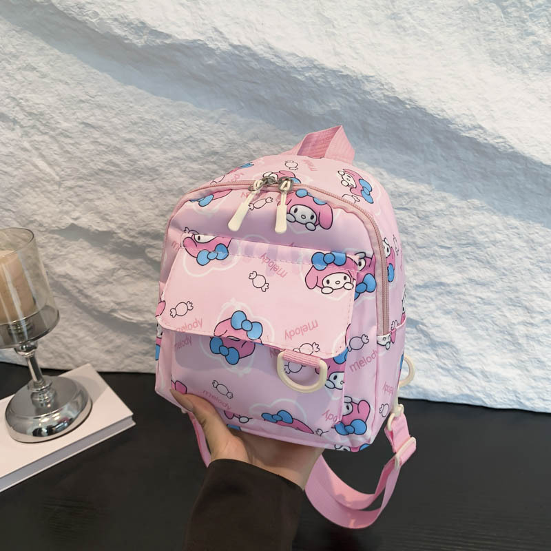 Mochila nueva al por mayor 2025, mochila de tela Oxford con diseño de dinosaurio de dibujos animados, mochila pequeña de gran capacidad para actividades al aire libre y ocio.