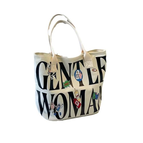 Autumn and winter large-capacity bucket bag for women, 2025 new style, niche cartoon canvas tote bag, college student's shoulder tote bag