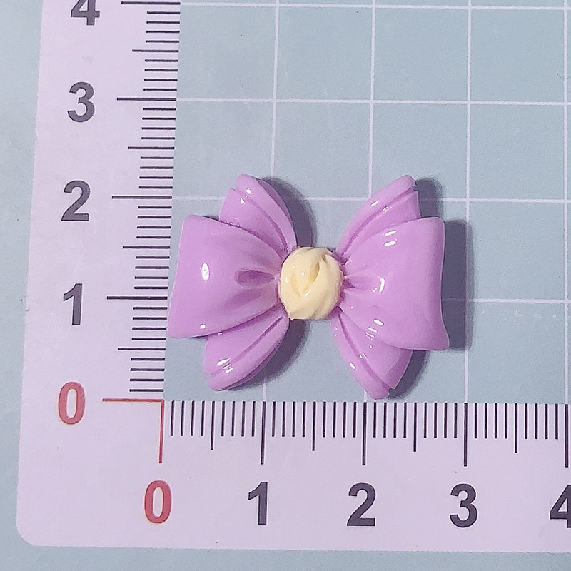 Nuevos accesorios de resina de color macaron de lazo de dibujos animados