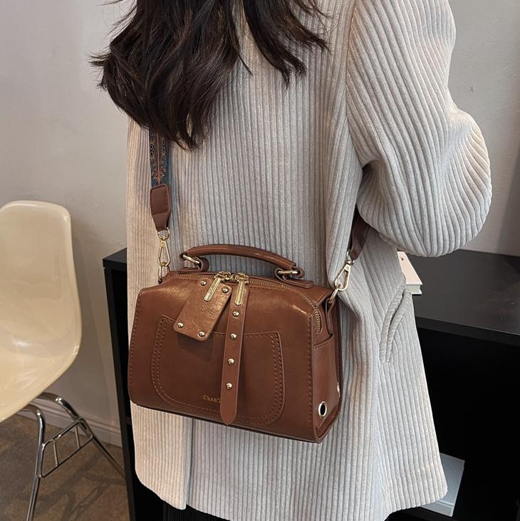 Bolso de viajero retro transfronterizo para mujer 2025 nuevo bolso de Boston casual simple moda bolso de mensajero portátil de todo fósforo