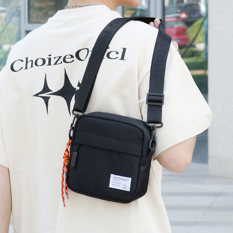 Caza del lobo 2023 bolso del teléfono móvil verano de los hombres mini bolsa de mensajero de moda bolso de hombro de los hombres calle de moda simple pequeña bolsa de moda