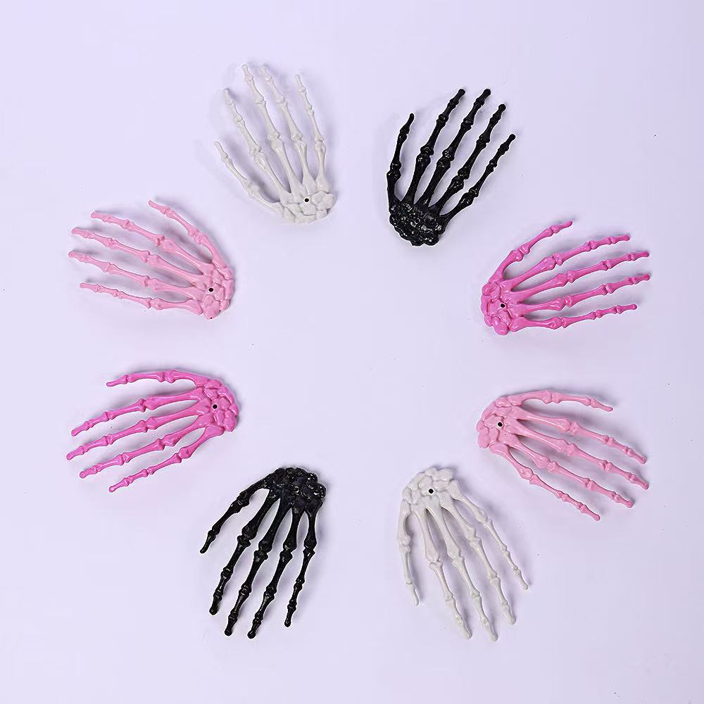 Accesorios de Halloween esqueleto transfronterizo hueso de mano de plástico colorido hueso de mano fantasma accesorios de decoración fuente directa