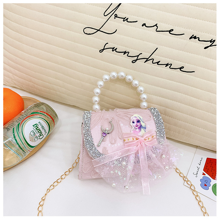 Nuevo bolso de moda para niños bolso de perla animado lindo arco de botón bolso de hombro de niñas cadena diagonal bolso pequeño