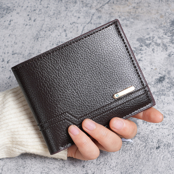 Short capacious wallet for leisure made of soft leather