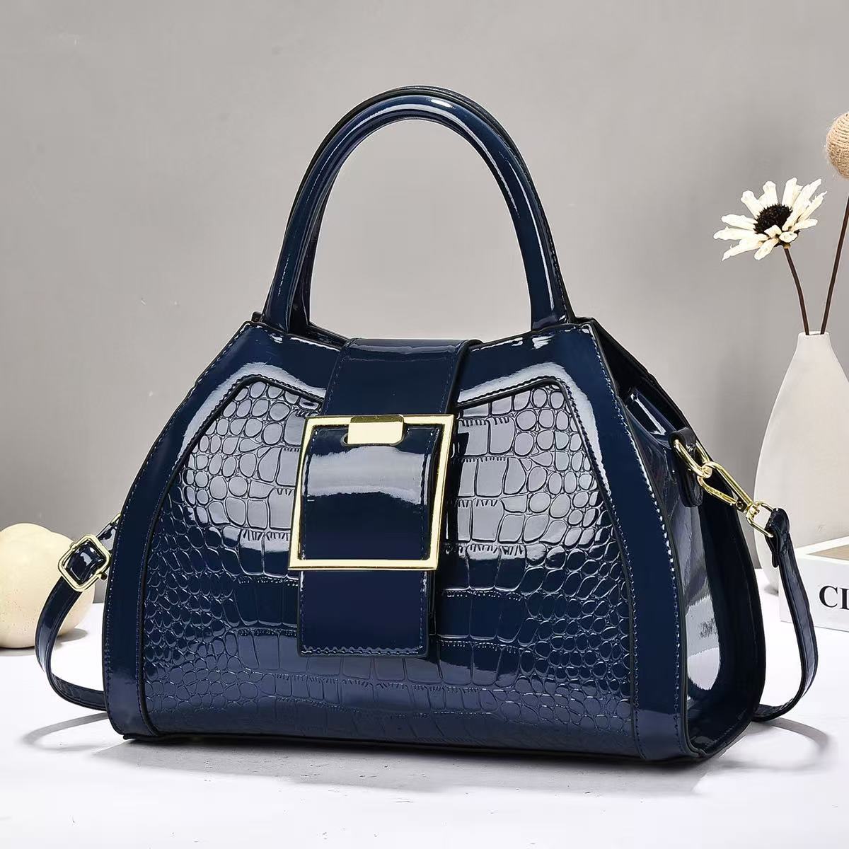 Bolsa de mano de piel brillante de piedra de gran capacidad simple atmósfera mochila de hombro de moda casual bolsas transfronterizas